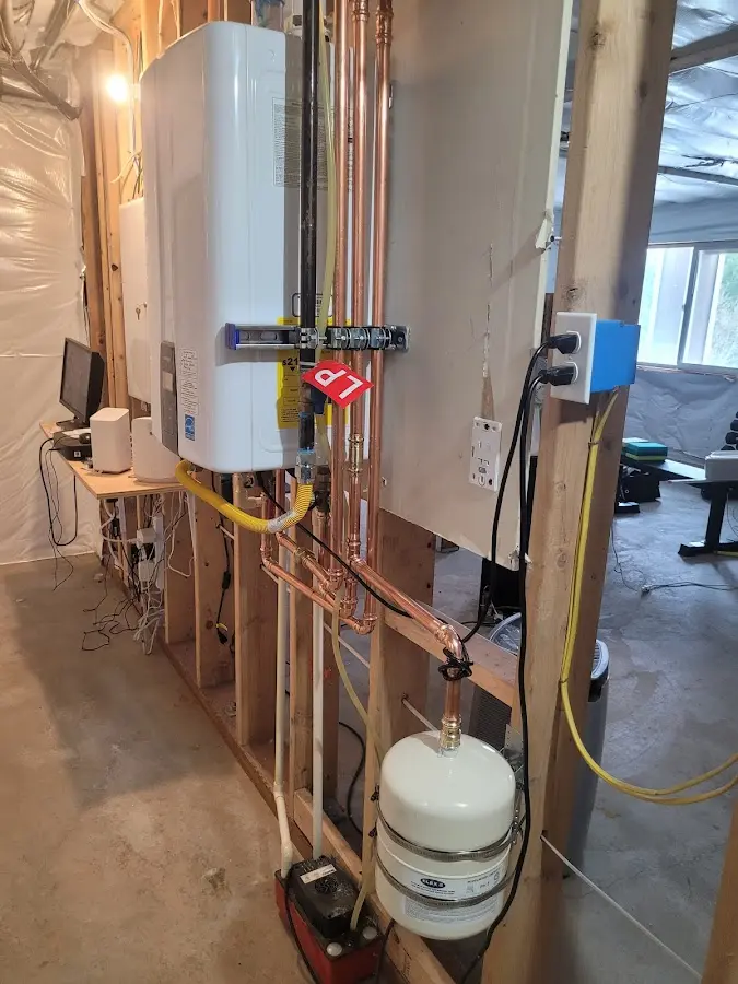 Licensed plumber repairing a kitchen sink in Dilworth